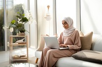 Woman working on laptop. 