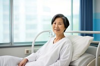 Mature woman patient in hospital gown. 