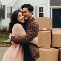 Happy couple moving into new house. 