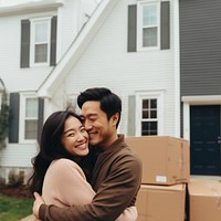 Happy couple moving into new house. 