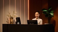 Female hotel receptionist. 