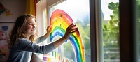 Painting rainbow window. 