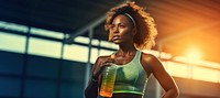 Woman holding water bottle. 