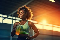 Woman holding water bottle. 