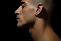 Man neck portrait jewelry earring. 