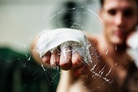 Man punching glass, cracked effect