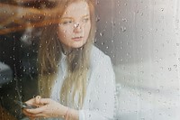 Woman in cafe with rain effect