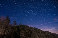 Night landscape photo with shooting stars effect