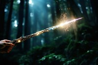 Magical wand beam illuminated fireworks darkness. AI generated Image by rawpixel.