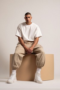 A man sitting fashion adult. AI generated Image by rawpixel.