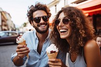 Eating laughing outdoors dessert. 