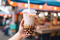 Bubble tea cup holding drink hand. AI generated Image by rawpixel.