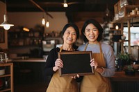 Middle age asian women holding adult cafe. 