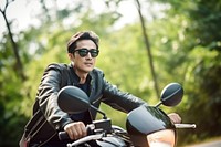 Young man riding motorcycle vehicle glasses sports. AI generated Image by rawpixel.