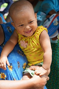 Baby smiles at net distribution.