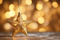 Sparkling golden christmas star backgrounds illuminated celebration. AI generated Image by rawpixel.