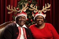 Couple wearing reindeer antlers christmas portrait adult. AI generated Image by rawpixel.