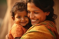 Woman holding adorable baby laughing portrait adult. 