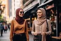 Two young Kuala Lumpur woman laughing street scarf. AI generated Image by rawpixel.