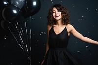 Happy woman wear black dress celebration laughing balloon. AI generated Image by rawpixel.