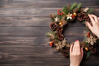 Christmas wreath hand celebration decoration. AI generated Image by rawpixel.