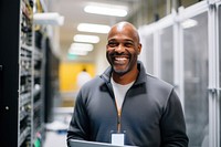 Smiling technician with laptop in server room computer adult entrepreneur. AI generated Image by rawpixel.