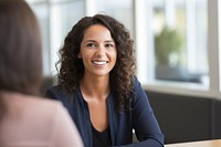 A woman in casual interview office smile. AI generated Image by rawpixel.