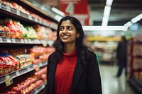 Happy indian woman supermarket shopping store. 