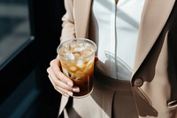 Standing holding coffee drink. AI generated Image by rawpixel.