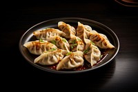 Dumpling plate food meal. AI generated Image by rawpixel.