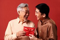 Chinese man glasses family giving. AI generated Image by rawpixel.