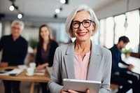 Senior business woman glasses smiling working. AI generated Image by rawpixel.