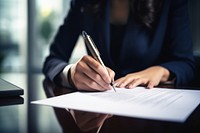 Businessperson signs contract writing office paper. 