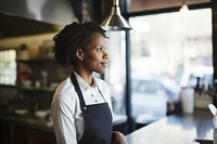 Mid adult black woman restaurant portrait kitchen. 