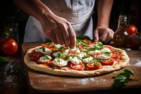 Making topping pizza cooking table food. AI generated Image by rawpixel.