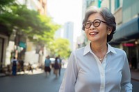 Thai senior businesswoman glasses adult smile. AI generated Image by rawpixel.