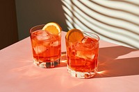 Aperol negroni cocktail drink glass. AI generated Image by rawpixel.