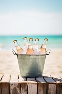 Bottles beach table drink. AI generated Image by rawpixel.