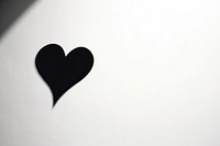 A simple heartshape shadow black white wall. AI generated Image by rawpixel.