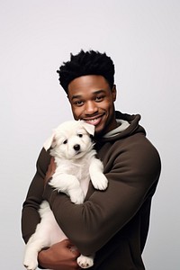 Happy black man hugging cute puppy portrait mammal adult. AI generated Image by rawpixel.