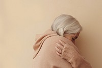 Older woman hugging adult face. AI generated Image by rawpixel.