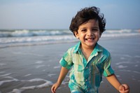 Pakistani kid beach photography portrait. AI generated Image by rawpixel.