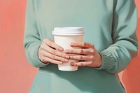 Hand cup holding coffee. AI generated Image by rawpixel.