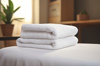White towel folded bed relaxation furniture. AI generated Image by rawpixel.