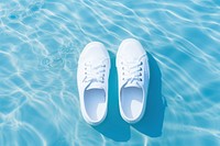 White sneakers product footwear water shoe. AI generated Image by rawpixel.