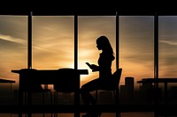 Businesswoman silhouette laptop sunset. AI generated Image by rawpixel.