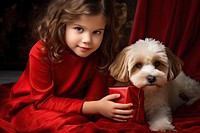 Little girl wearing red sweater wrapping gifts puppy portrait mammal. AI generated Image by rawpixel.