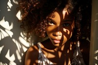 Smiling young african american girl photography portrait shadow. AI generated Image by rawpixel.