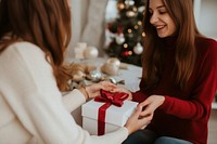 Christmas surprise adult gift. AI generated Image by rawpixel.