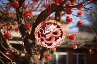 Dragon decoration hanging tree. AI generated Image by rawpixel.